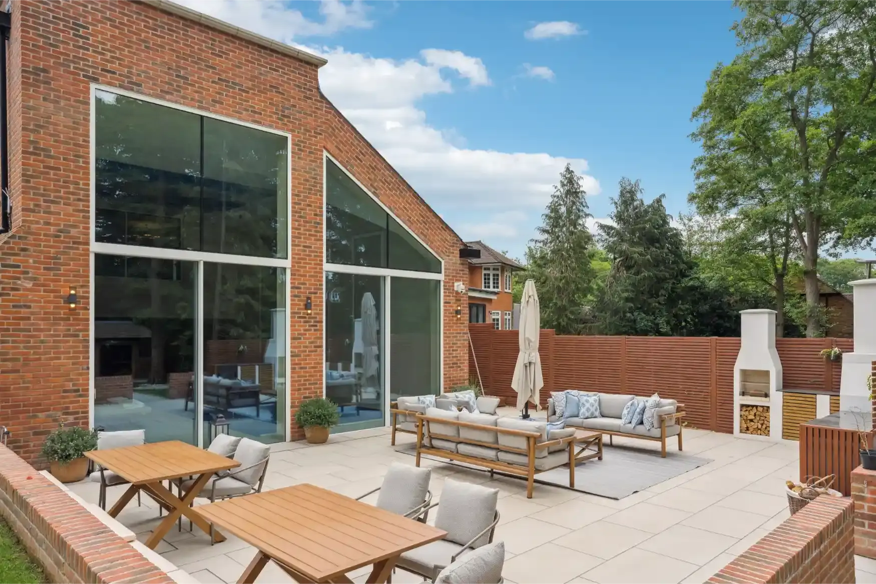 A landscaped garden and patio to the rear of a newly built brick home